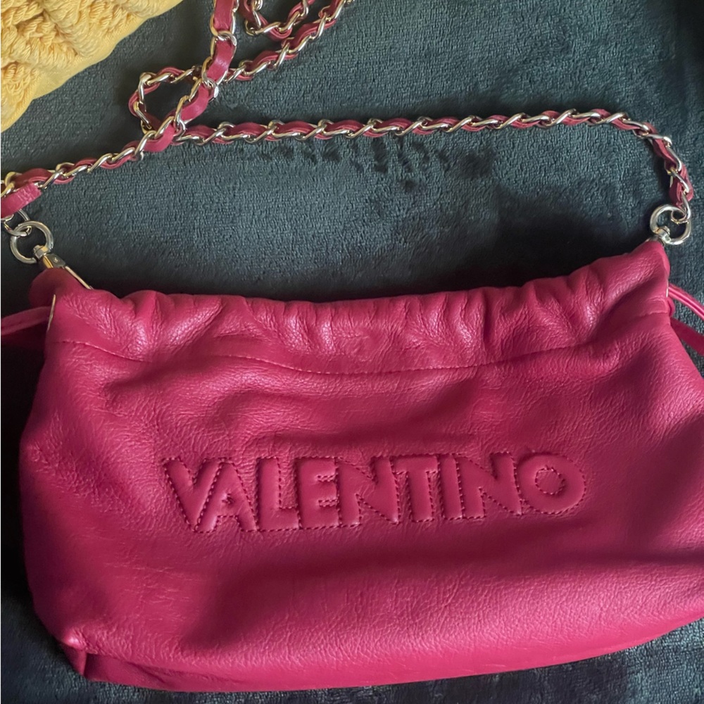 Valentino bag in color Lipstick Red. Super playful and perfect for a night out.